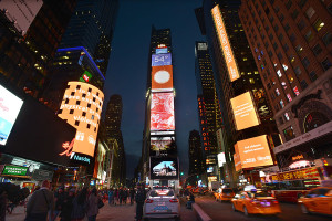 Orange signage on the NASDAQ and Reuters tickers in Times Square are seen to highlight the cause to End Violence against Women